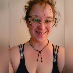 - Black X shaped rhinestone covered with dangling crystal like black facet…